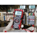 UT89X multimeter measuring AC voltage in an electrical panel