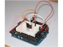 Arduino prototype shield with mini breadboard wired to a resistor and component